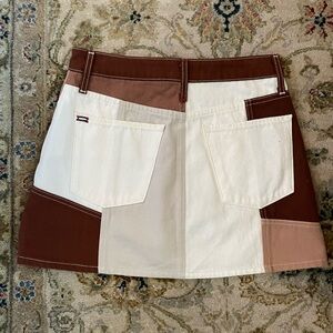 Alice+Olivia size 28 mini skirt.Very good condition. No stains or torn. Neutral